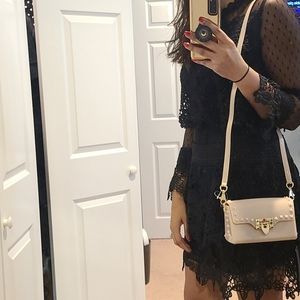 Beige rockstud clutch crossbody bag